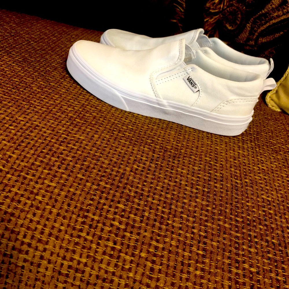 Vans white shoes.